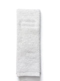 A folded white cotton towel with a soft, plush terry texture, shown vertically against a plain white background.